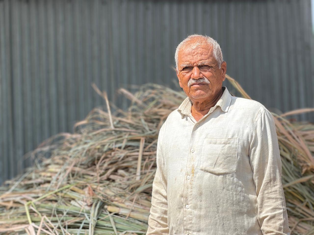 Farmer with collected biomass feedstock